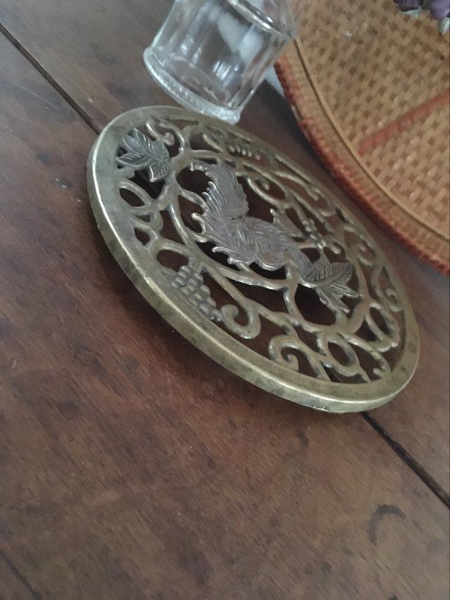 Underneath the brass dish