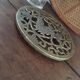 Underneath the brass dish