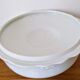 White porcelain soup tureen from Limoges with a vegetal scroll design.