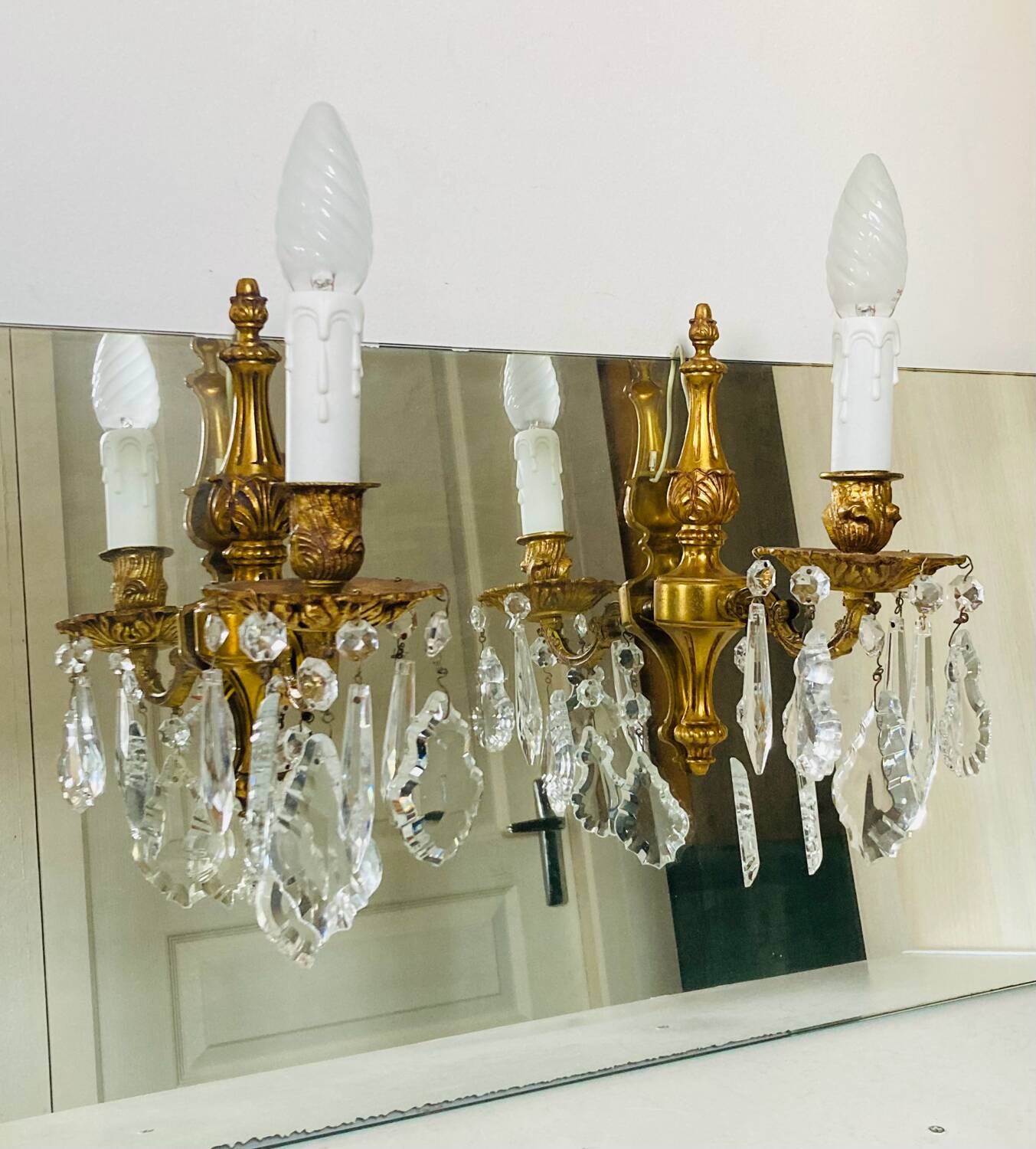 St Louis XV wall lights in gilded bronze with pendants from the mid-20th century.