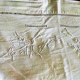 Old drapework and embroidered with 2 flowers and a butterfly