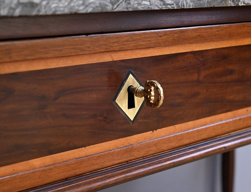 Console in mahogany and marble, Louis XVI period – late 18th century.
