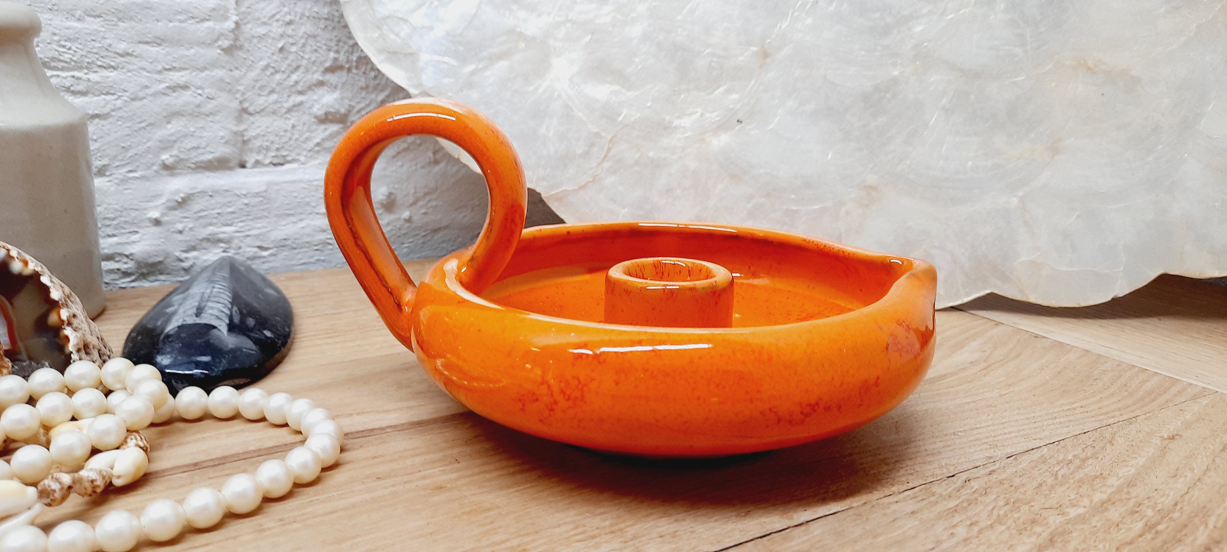 Orange cellar rat candle holder