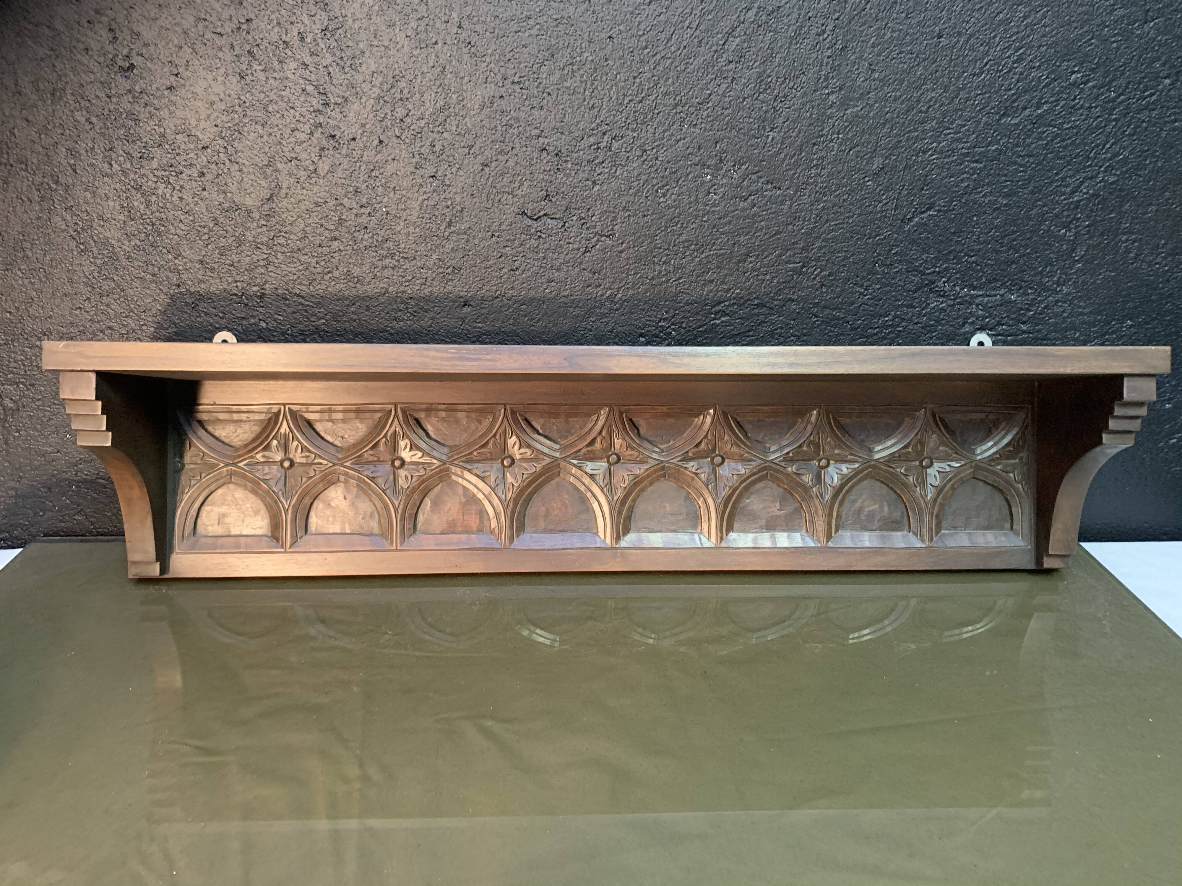 Carved wooden wall shelf