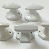 Five art deco white porcelain hooks