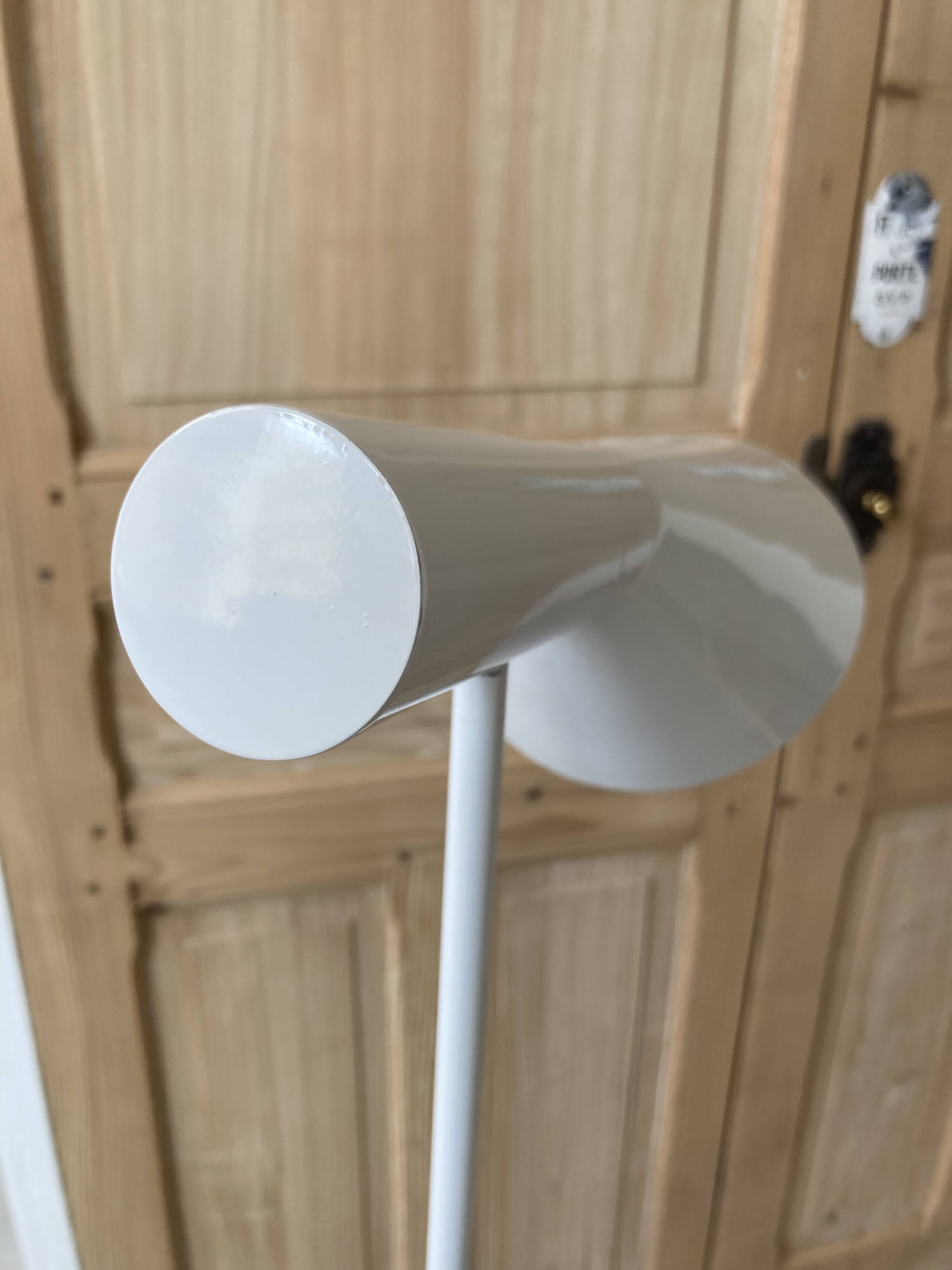 white lacquered metal reading lamp