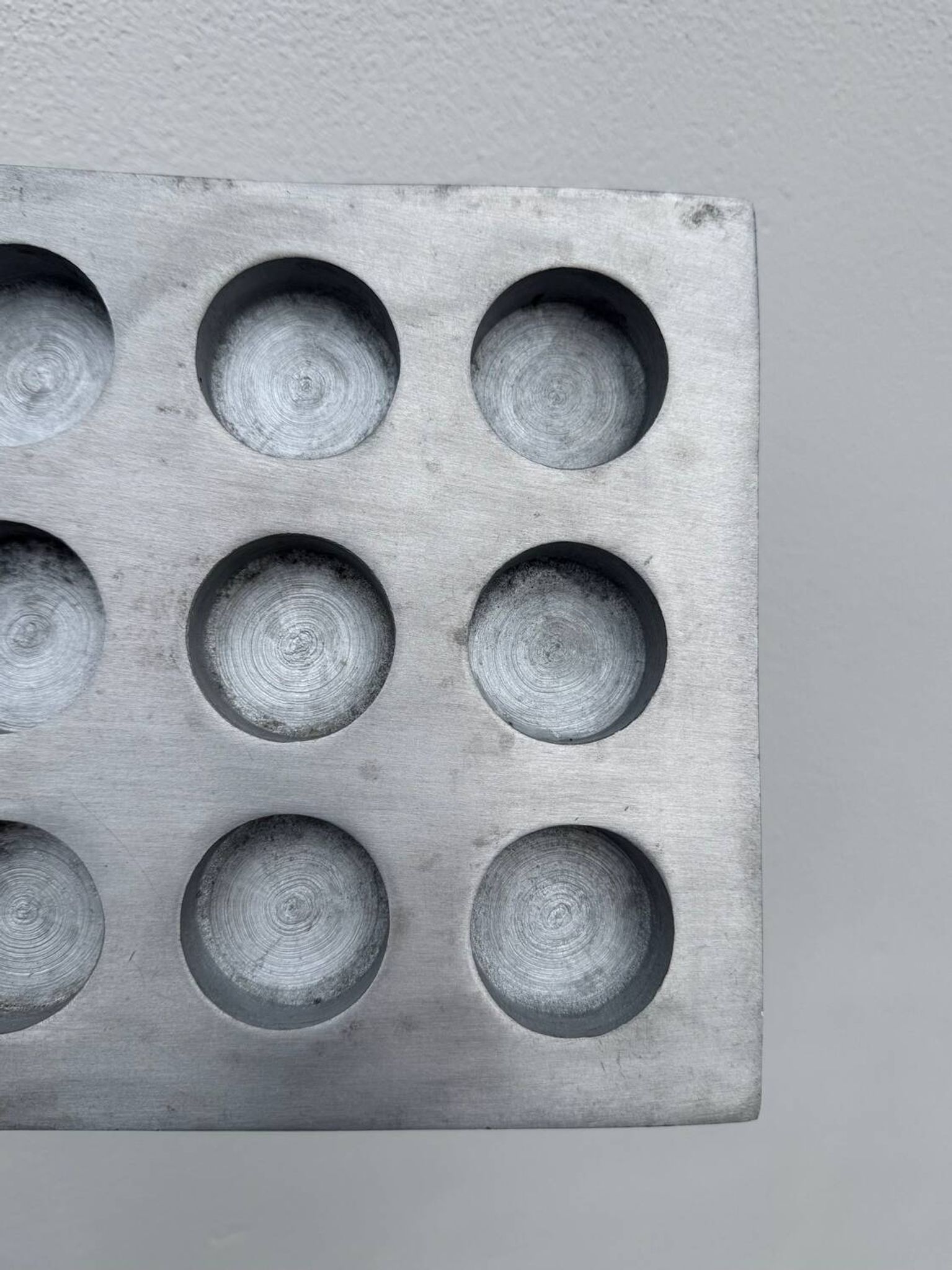 Brutalist style brushed aluminum candle holder