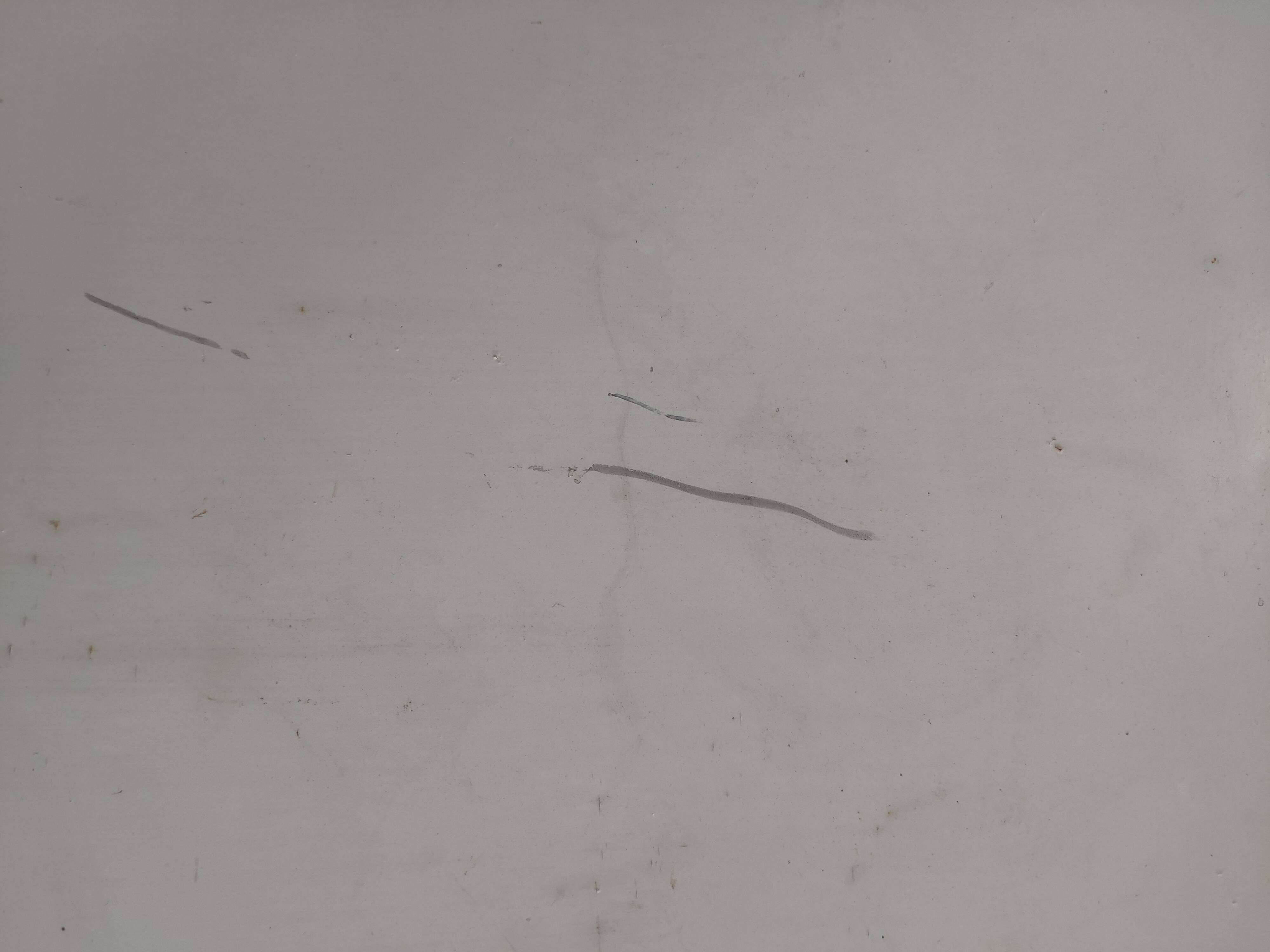 Old folding garden table in white wrought iron