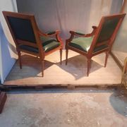 Pair of Louis XVI style armchairs upholstered in green leather.