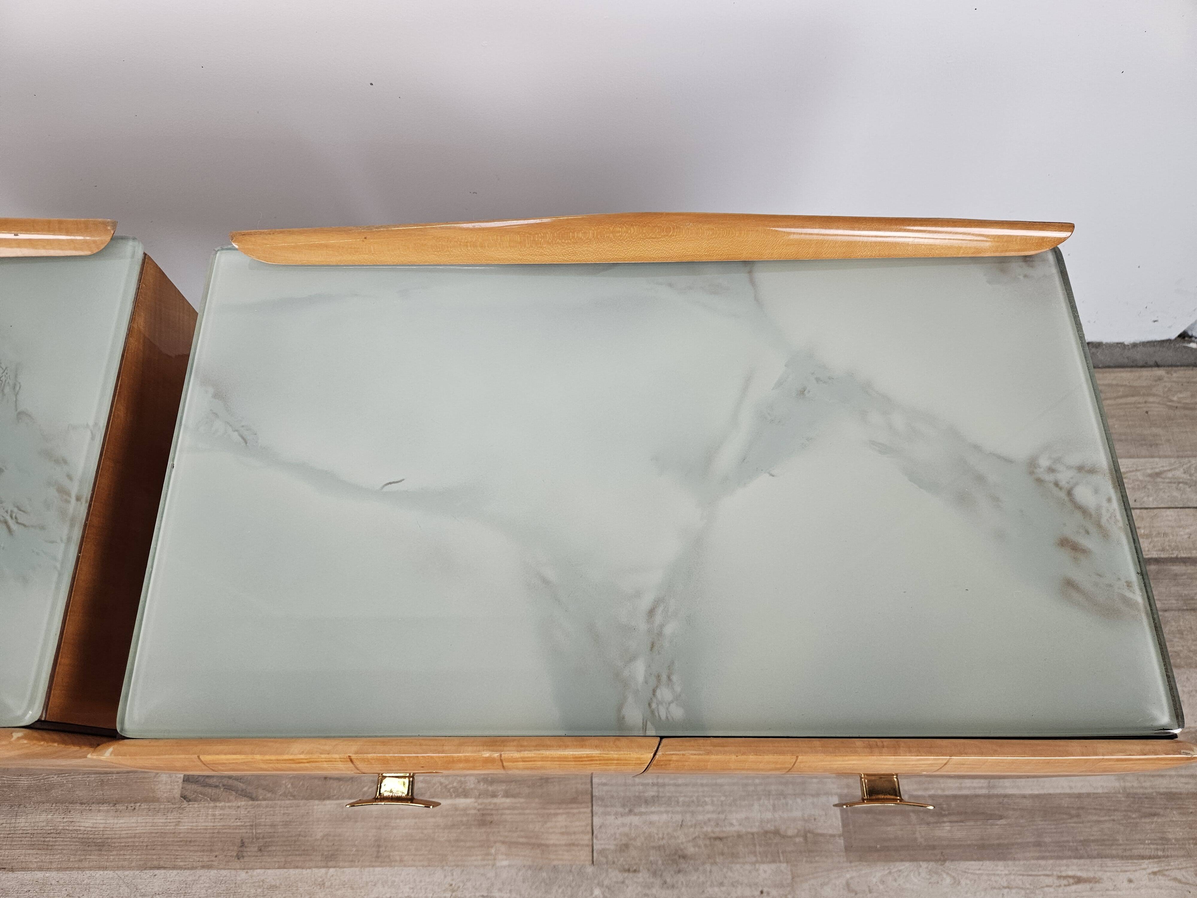 Mid-century nightstands in maple, brass, and glass