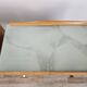 Mid-century nightstands in maple, brass, and glass