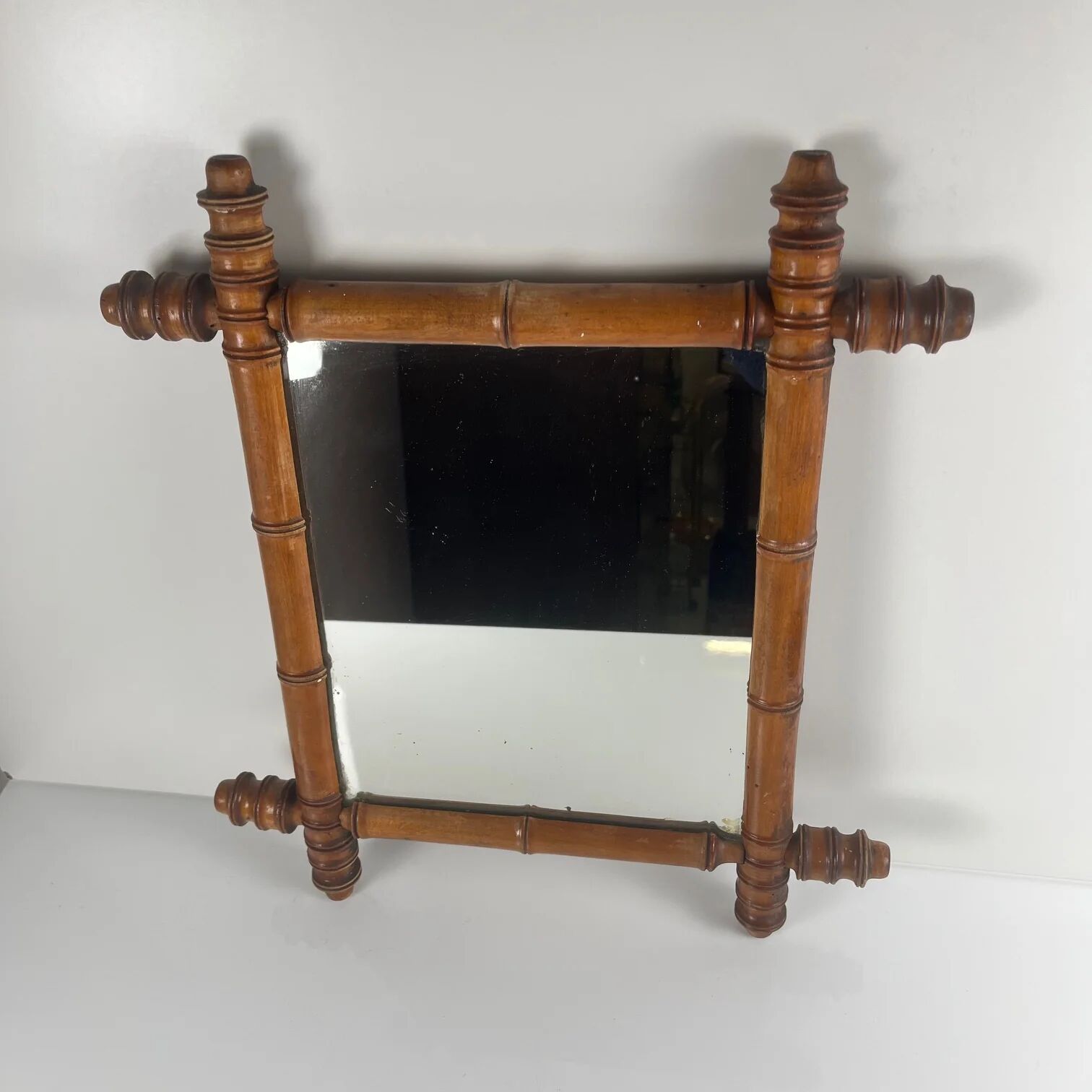 Wooden turned mirror in bamboo style, circa 1900-1930.