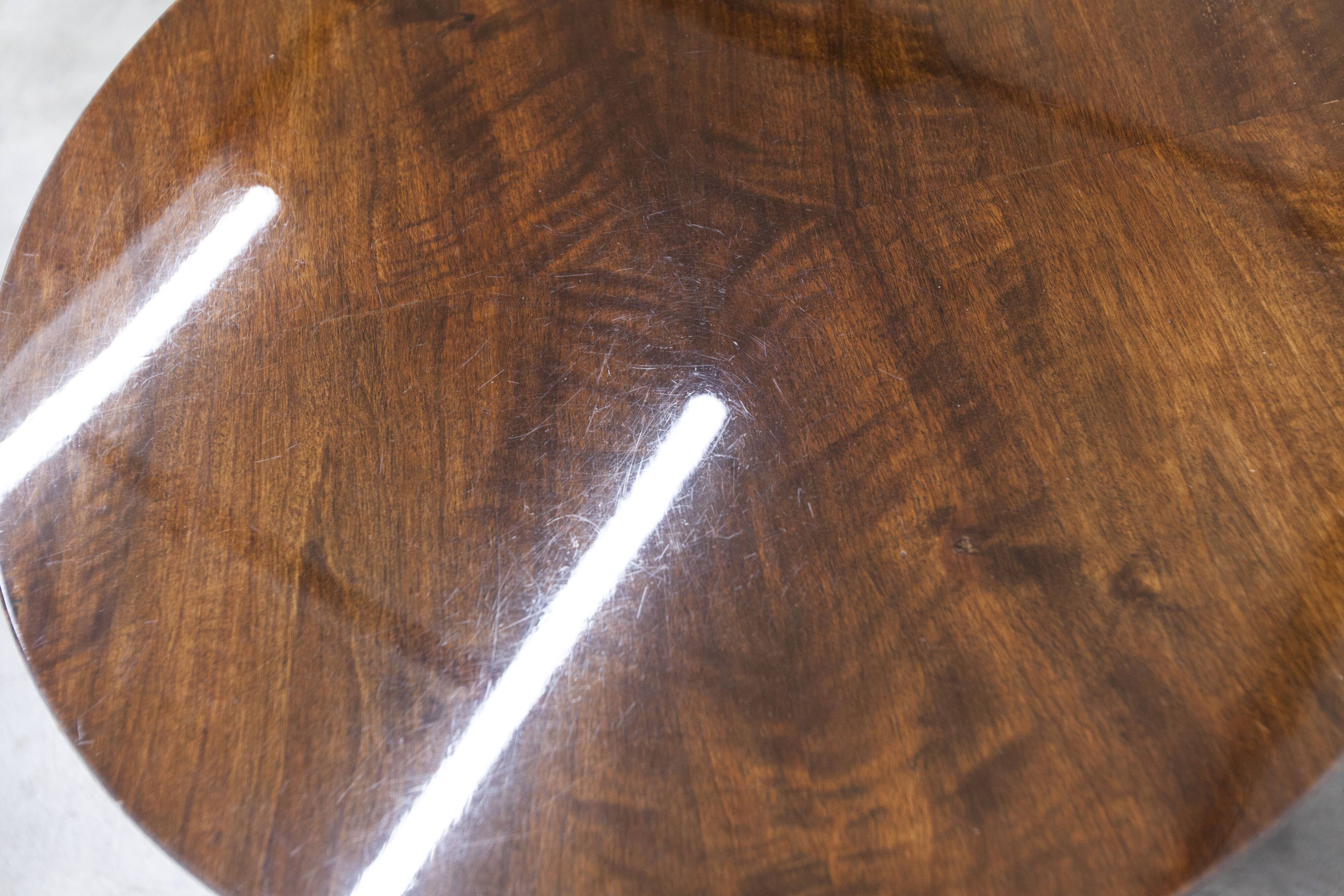 1960s Scandinavian tripod coffee table with glossy varnish in mahogany wood.