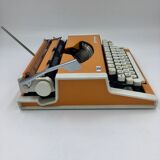 WE typewriter orange