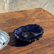 Vintage silver-plated shell butter dish with blue bowl.