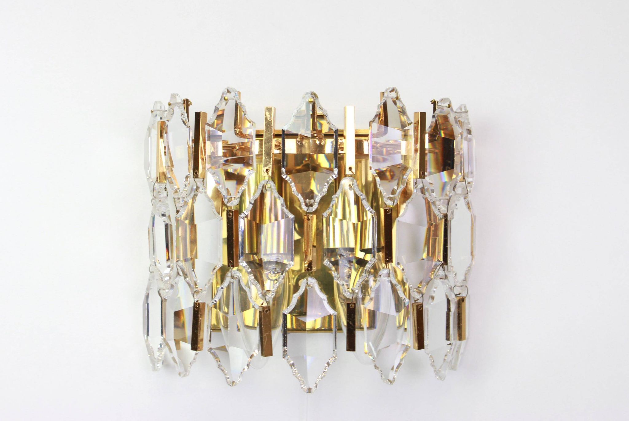 Pair of wall sconces in gilded brass and crystal by Palwa, Germany, 1970s.