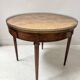 Louis XVI style bouillotte table in veneered wood, 20th century.