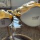 Pair of golden salt cellars in Limoges porcelain shaped like swans