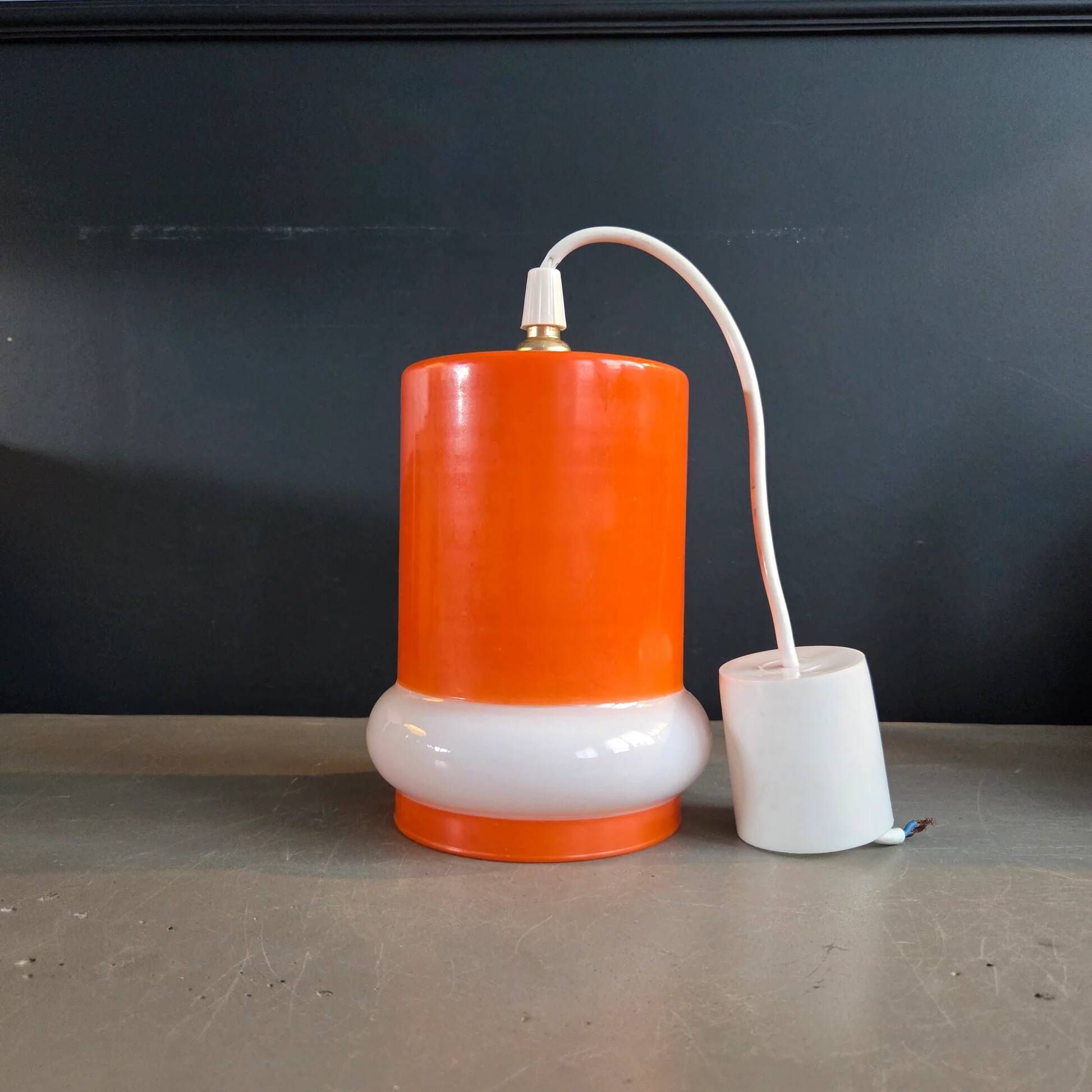 Vintage suspension in orange and white glass.