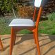 vintage wooden chairs with white faux leather