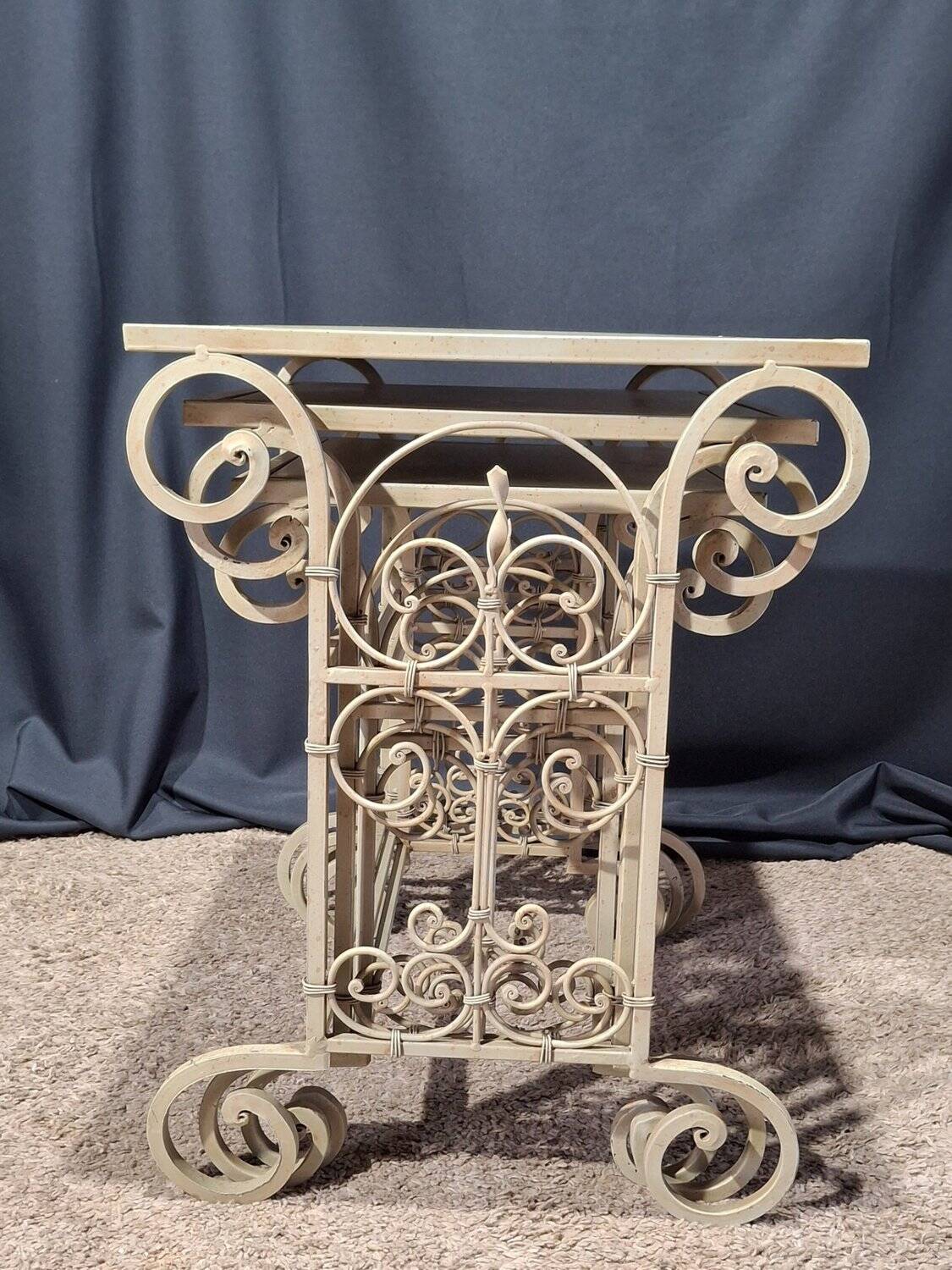 Nesting tables in patinated iron.
