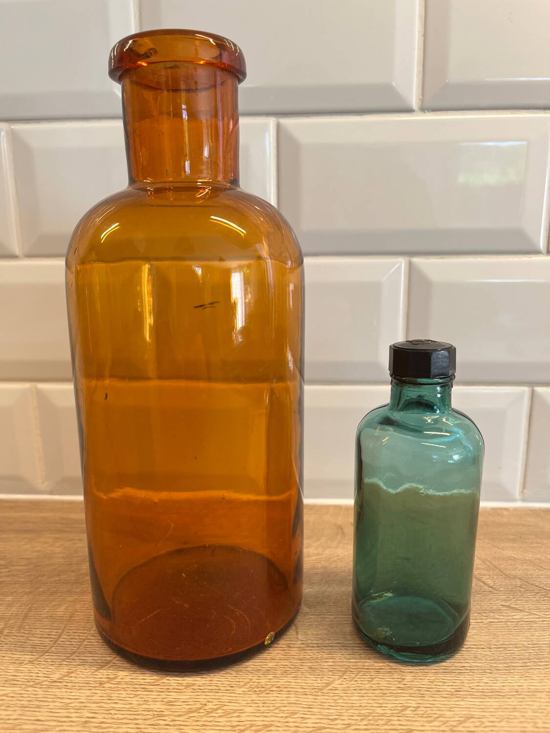 Small vintage dark turquoise blue bottle