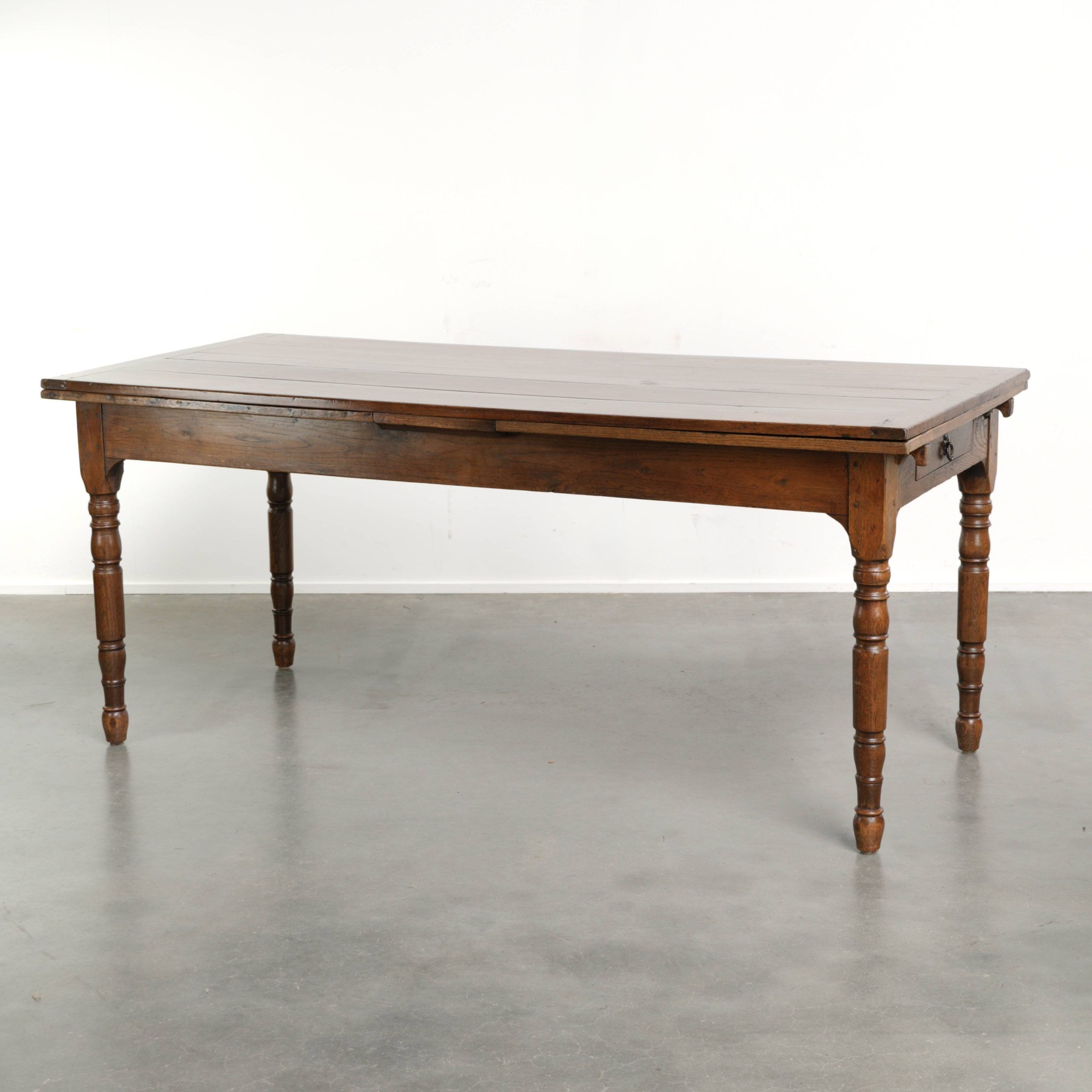 Antique oak dining table from the late 18th century with extendable leaves