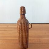 Bottle, old carafe in glass and wicker, 1950s