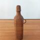 Bottle, old carafe in glass and wicker, 1950s