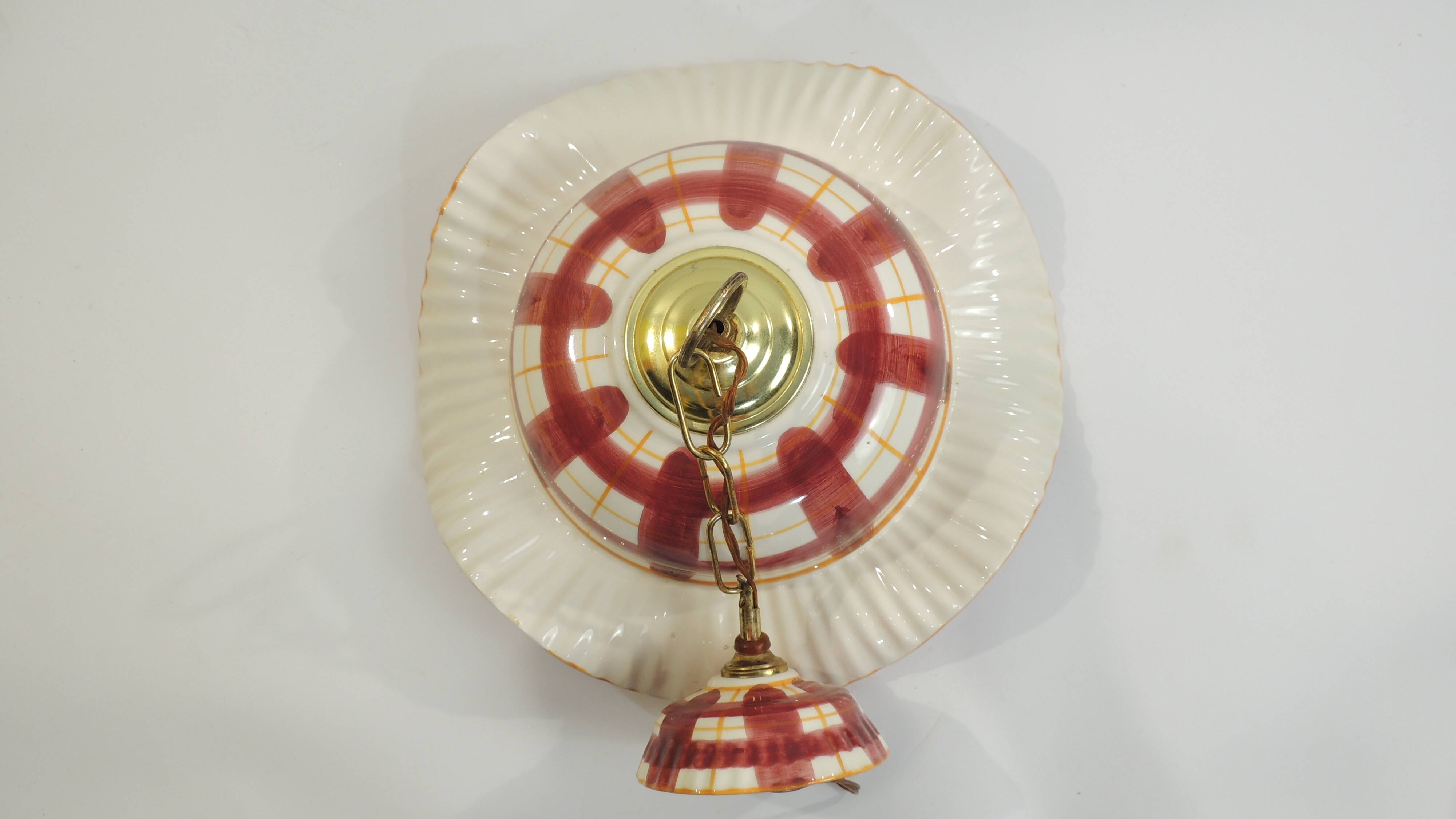 Vintage earthenware pendant light with a burgundy and ochre tartan pattern