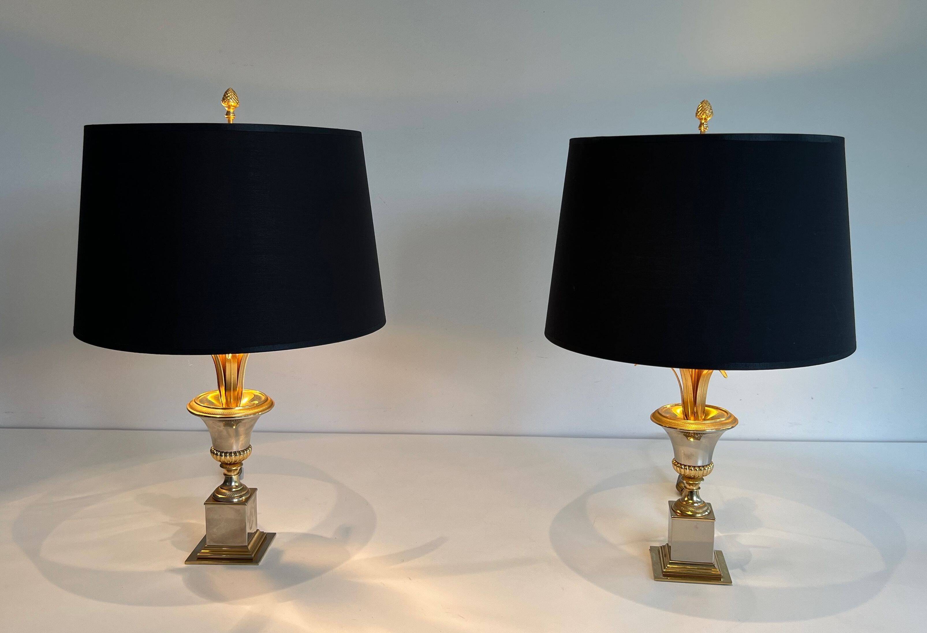 Pair of palm lamps in chrome and brass in the style of Maison Charles. Circa 1970.