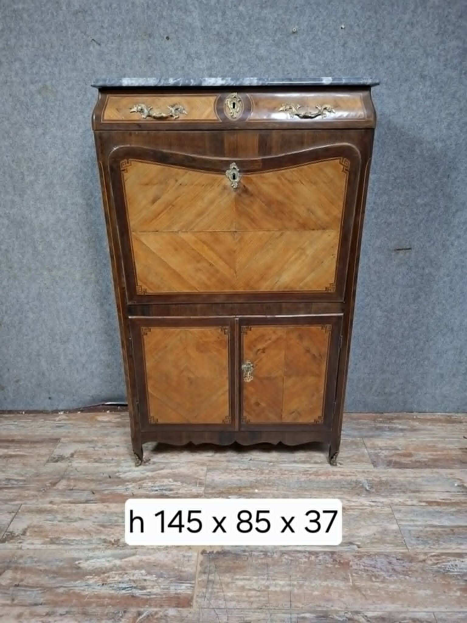 Louis XV period secretary in marquetry and veneer, 18th century.
