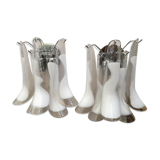 Wall sconces in white and transparent murano glass "saddle"