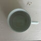 Set of 3 antique ceramic cups with blue floral pattern.