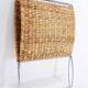 Chrome metal magazine rack with woven banana leaves
