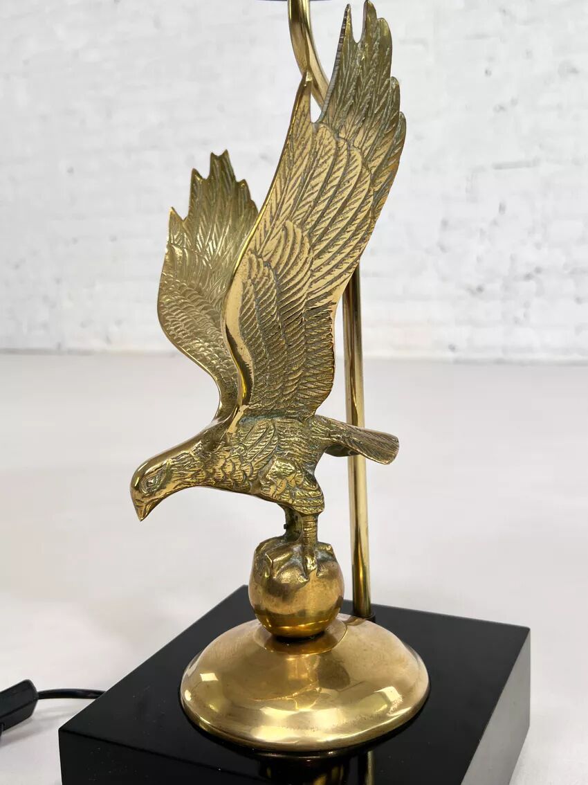 Brass lamp on black lacquered wooden base
