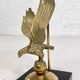Brass lamp on black lacquered wooden base