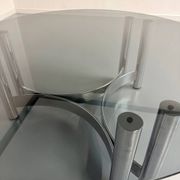 Round coffee table in smoked glass and chrome steel, 1970s design.