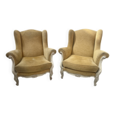 Paire de bergères a oreilles de style Louis XV en hêtre patiné XX siècle