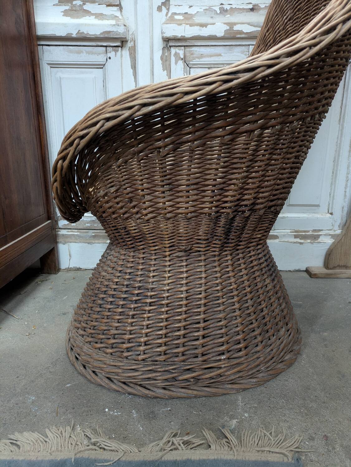 Large woven rattan armchair