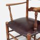 Antique rustic armchair in walnut and leather, 18th century.