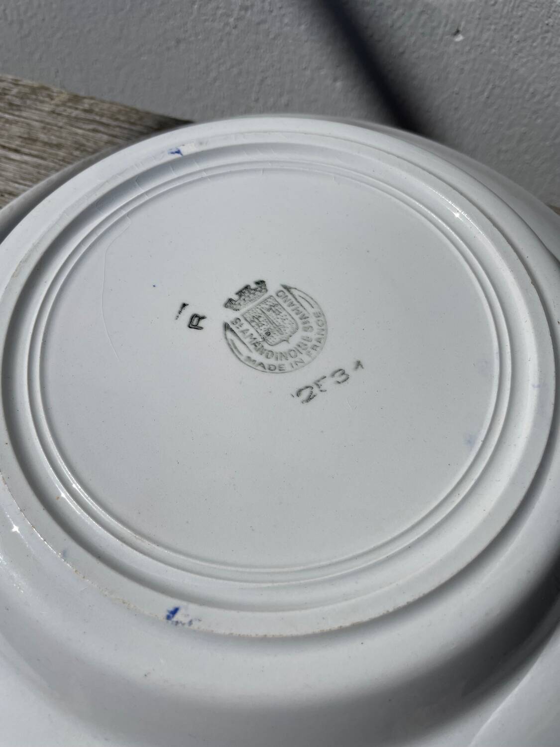 Round hollow ceramic dish with Saint Amand flower