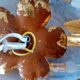 Old wall lamp palm shaped metal dore with leaf