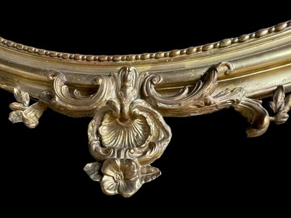 Miroir ovale Louis XV bois doré