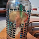 Seltzer water siphon in its protective grid