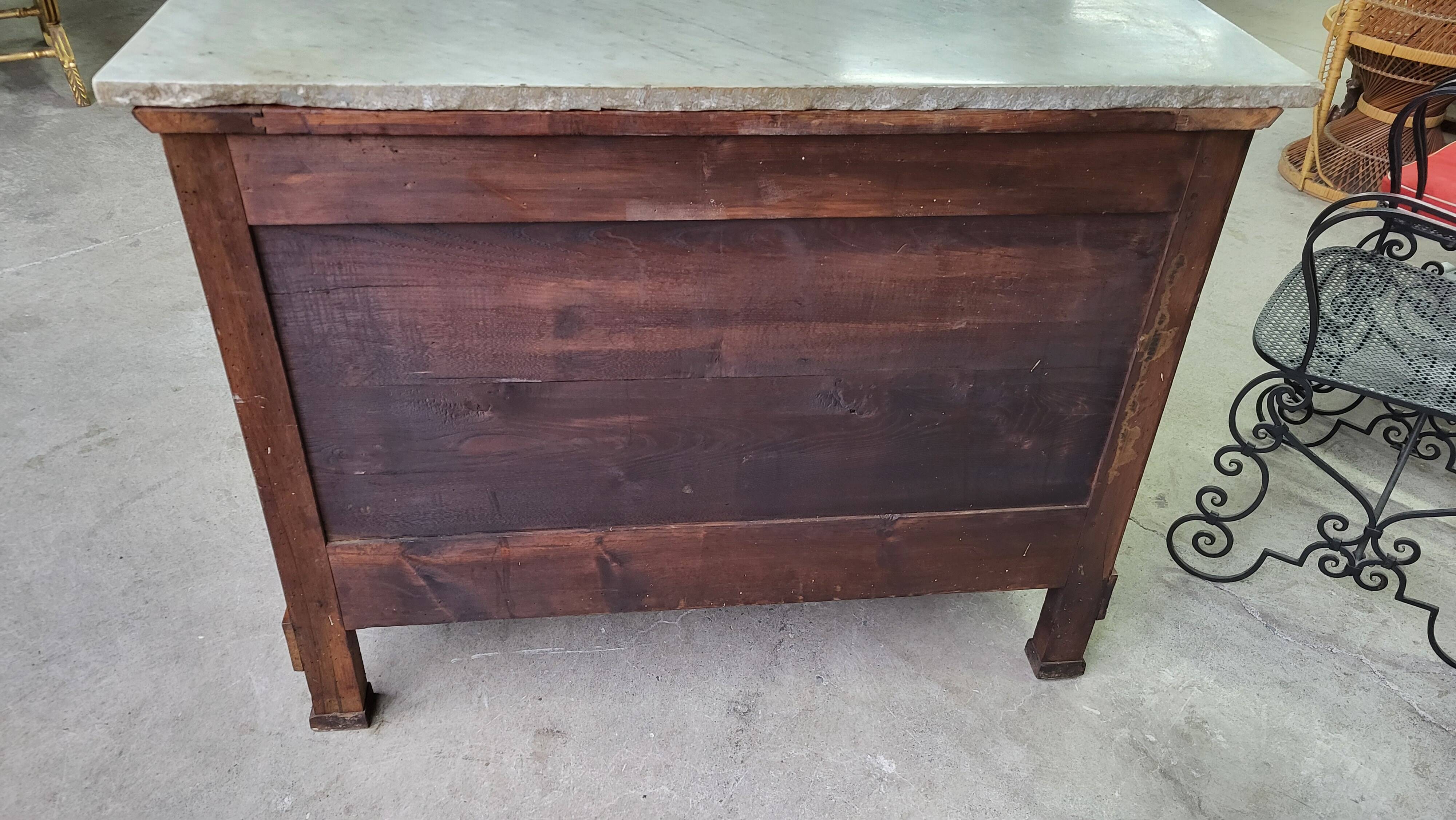 Empire commode in walnut with white marble top from the 19th century