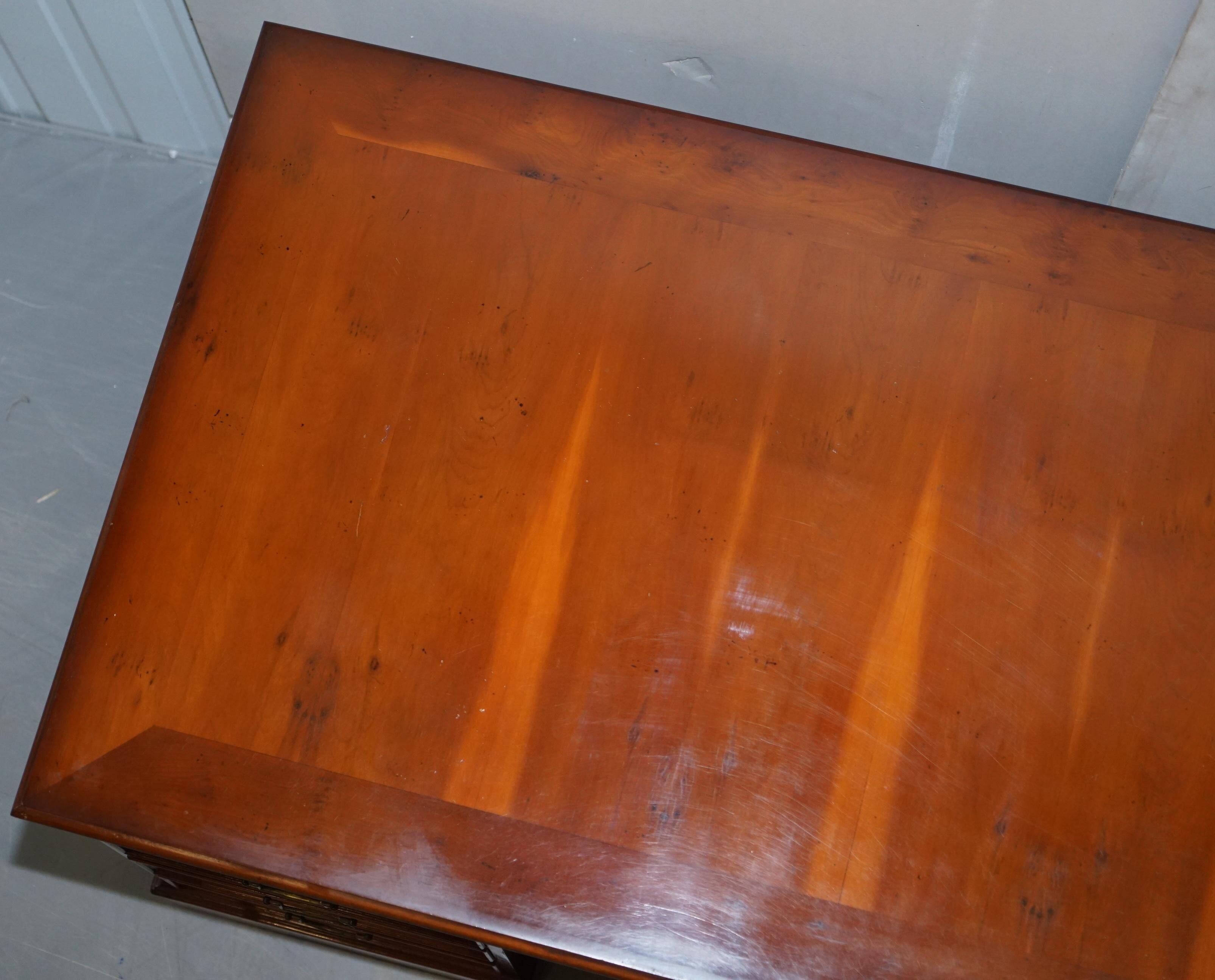 Partner desk with double pedestal in burr yew wood with decorated top.