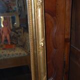 Miroir doré à fronton coquille de style Louis XV fin XIXème