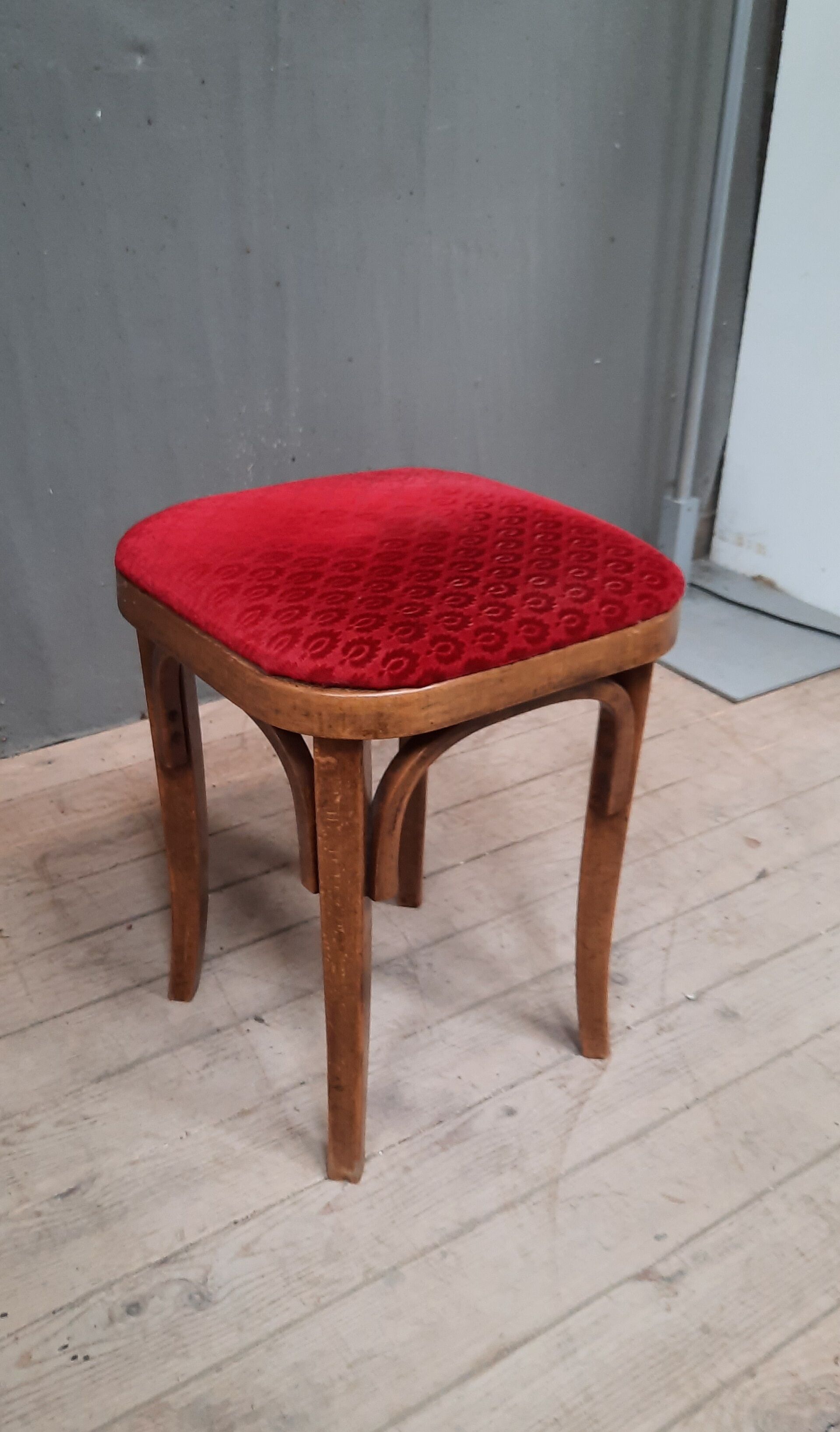 Curved wooden stool