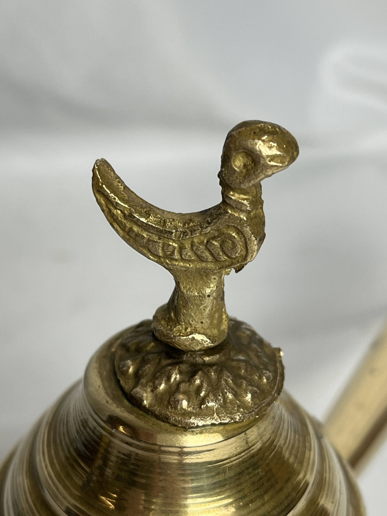 Brass dallah coffee pot with bird-shaped finial, 20th century.
